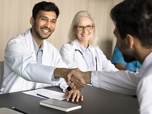 Doctor looking at hands